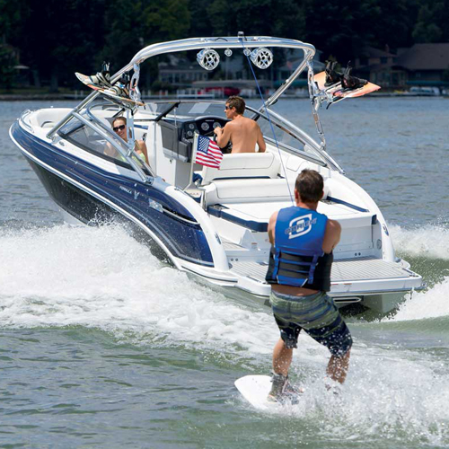 a man in a life vest is being towed by a boat