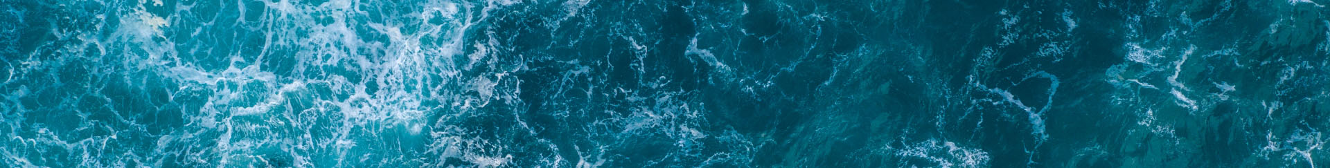 an aerial view of the ocean with waves