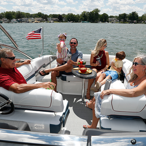 a family sits on a luxury speed boat that says Formula on the side