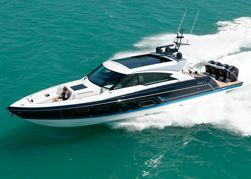 a black and white speed boat with the word Formula on the side