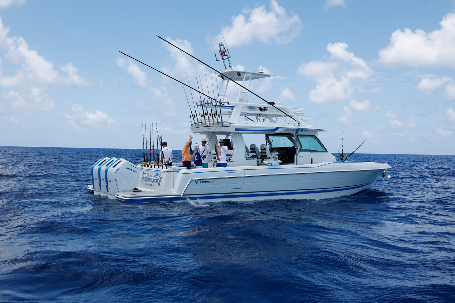 a white and blue boat with Formula on the side