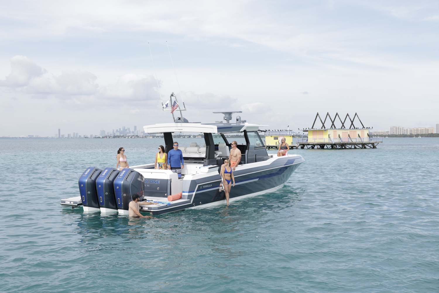a group of people are on a boat that says formula